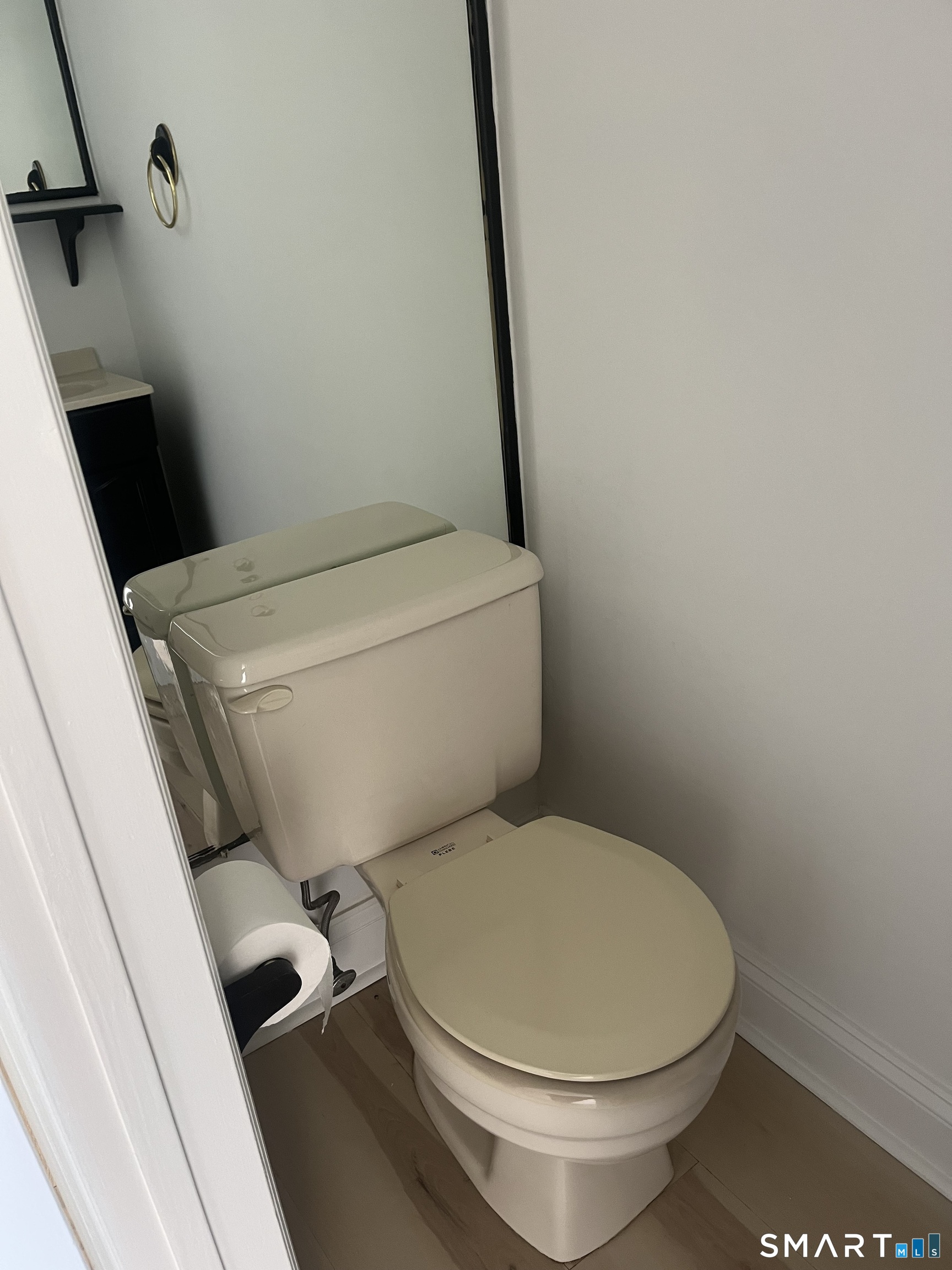 31 Stuart Avenue, Unit 12 Norwalk, CT 06850 - Photo 11 of 15 a white toilet sitting next to a sink
