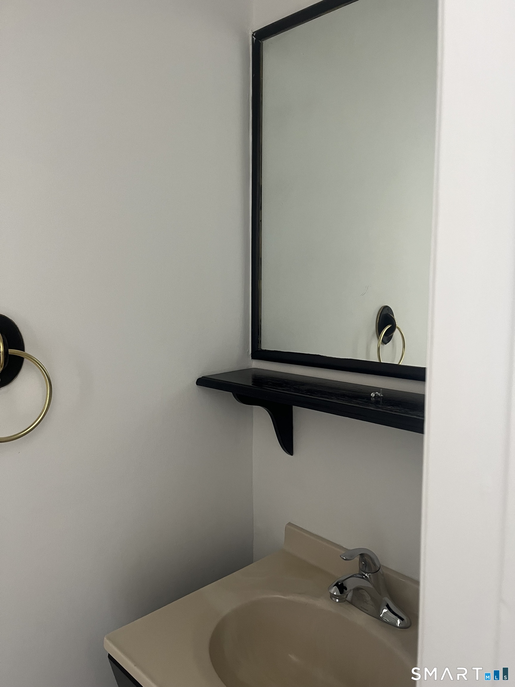 31 Stuart Avenue, Unit 12 Norwalk, CT 06850 - Photo 14 of 15 a bathroom with a sink and a toilet