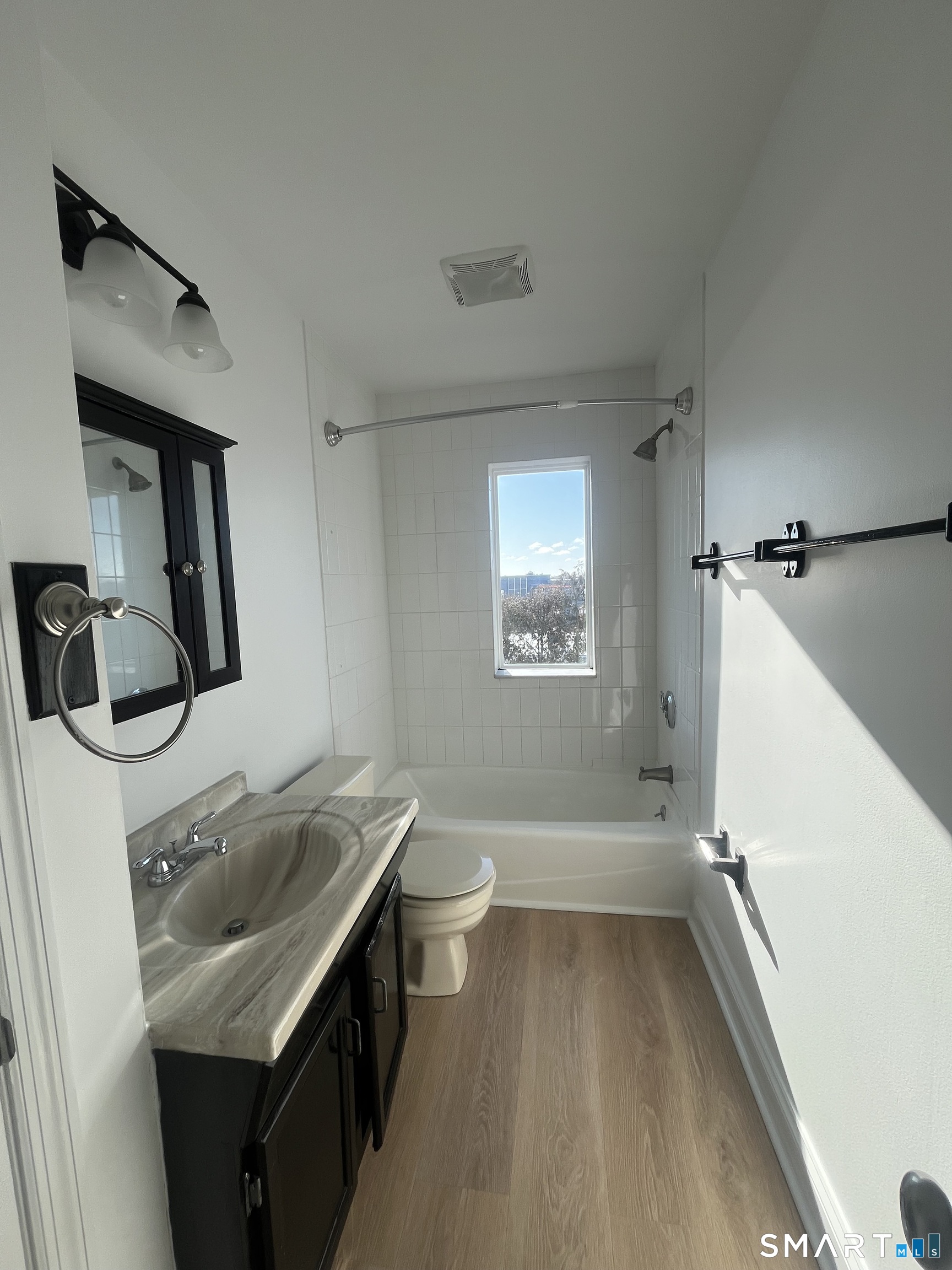 31 Stuart Avenue, Unit 12 Norwalk, CT 06850 - Photo 8 of 15 a bathroom with a sink toilet and shower