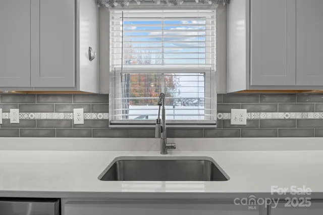 a kitchen with a stove and a microwave