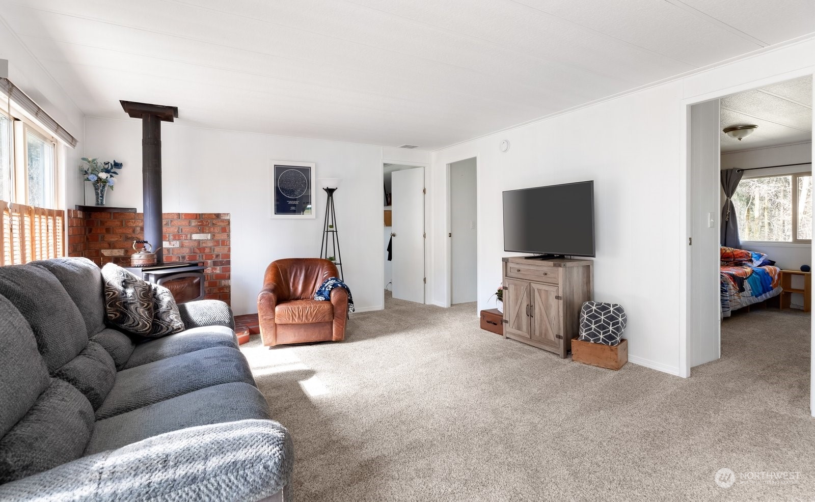 1742 Harns Road Oak Harbor, WA 98277 - Photo 16 of 37 a living room with furniture and a flat screen tv
