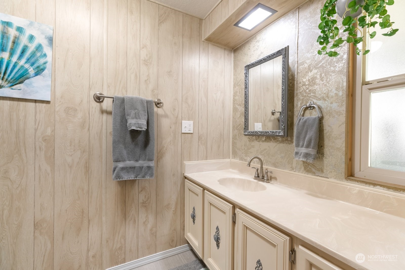 1742 Harns Road Oak Harbor, WA 98277 - Photo 19 of 37 a bathroom with a sink and a mirror