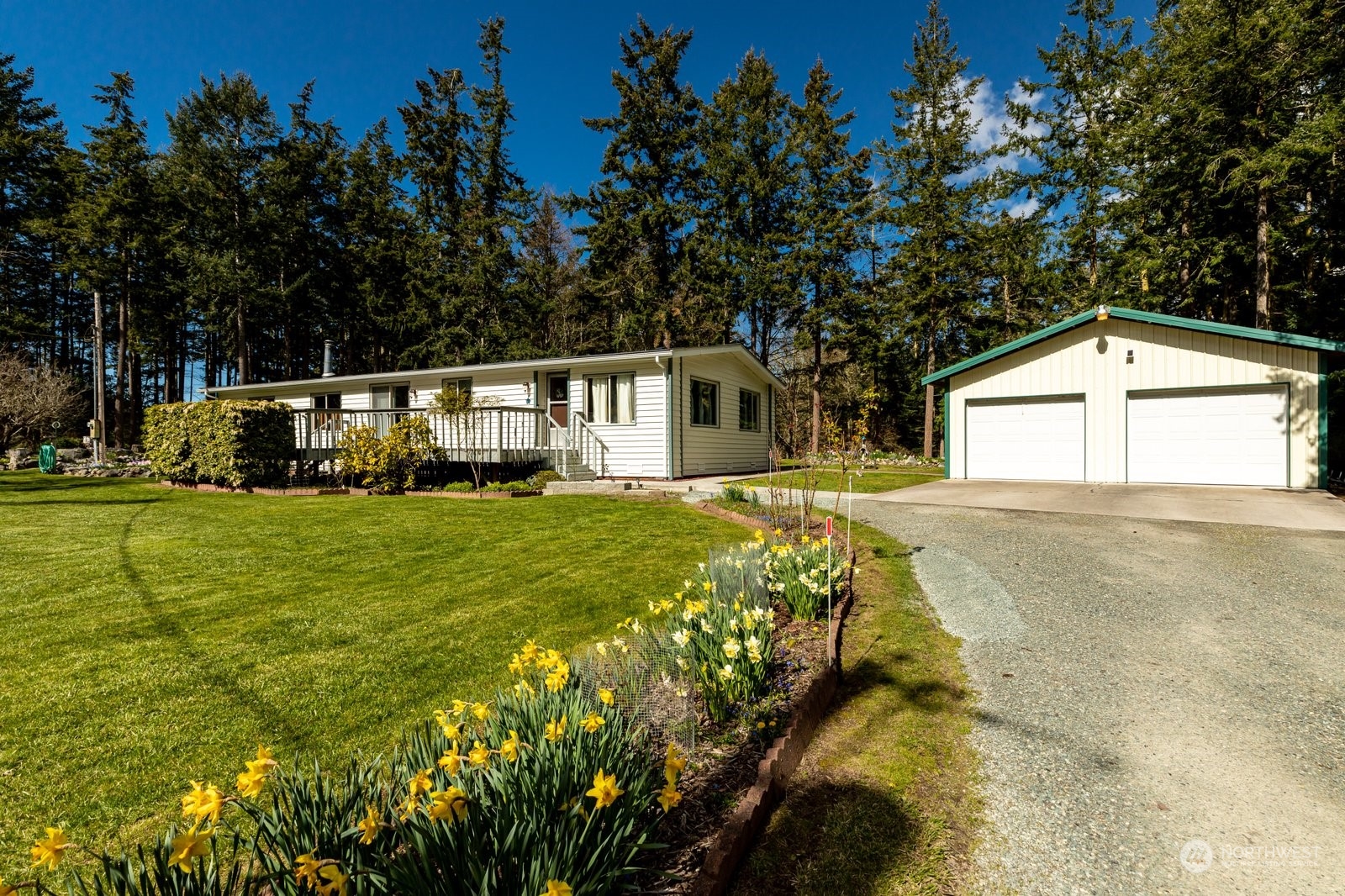 1742 Harns Road Oak Harbor, WA 98277 - Photo 2 of 37 a front view of a house with garden