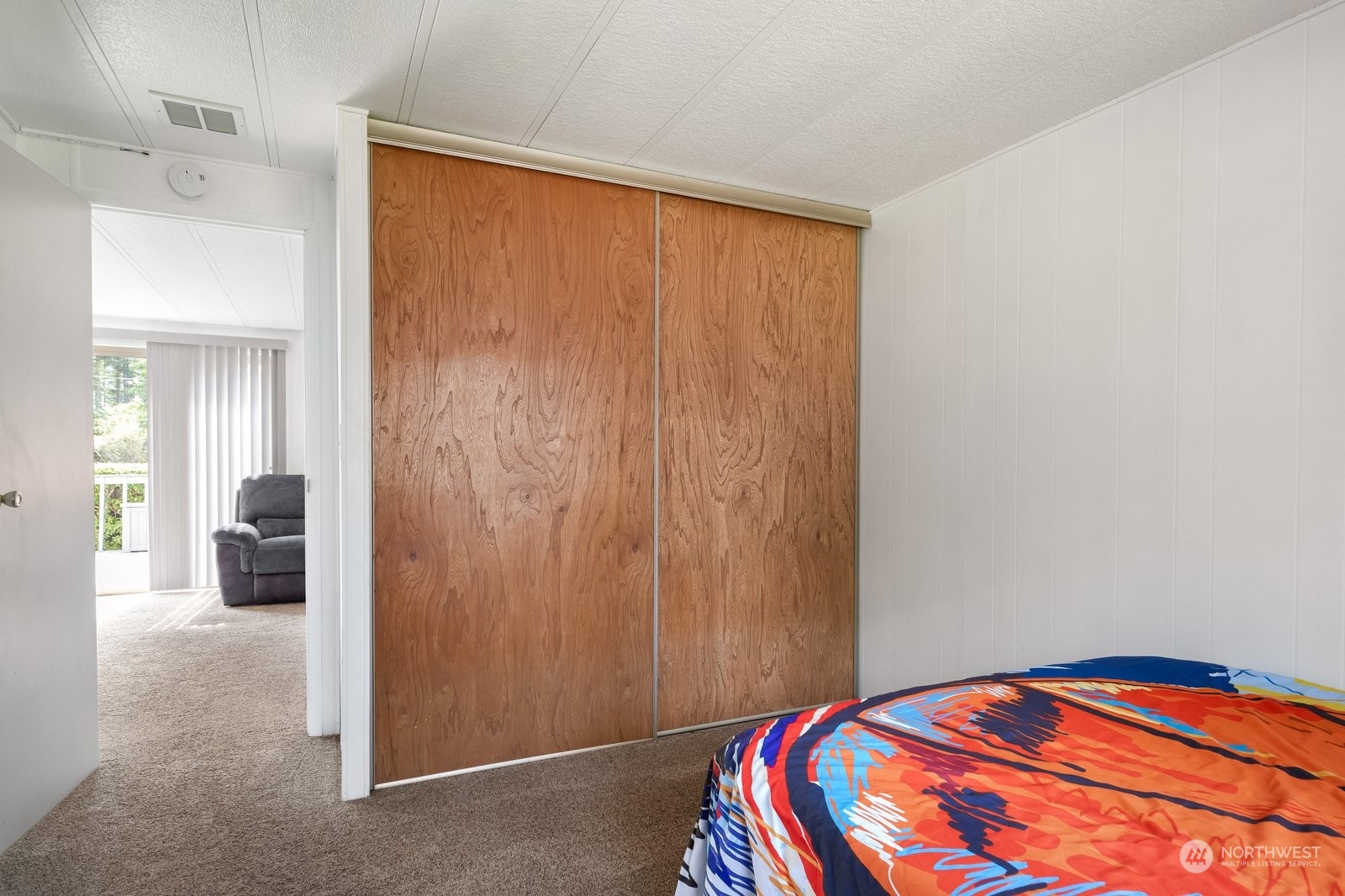 1742 Harns Road Oak Harbor, WA 98277 - Photo 22 of 37 a bedroom with a bed and a mirror