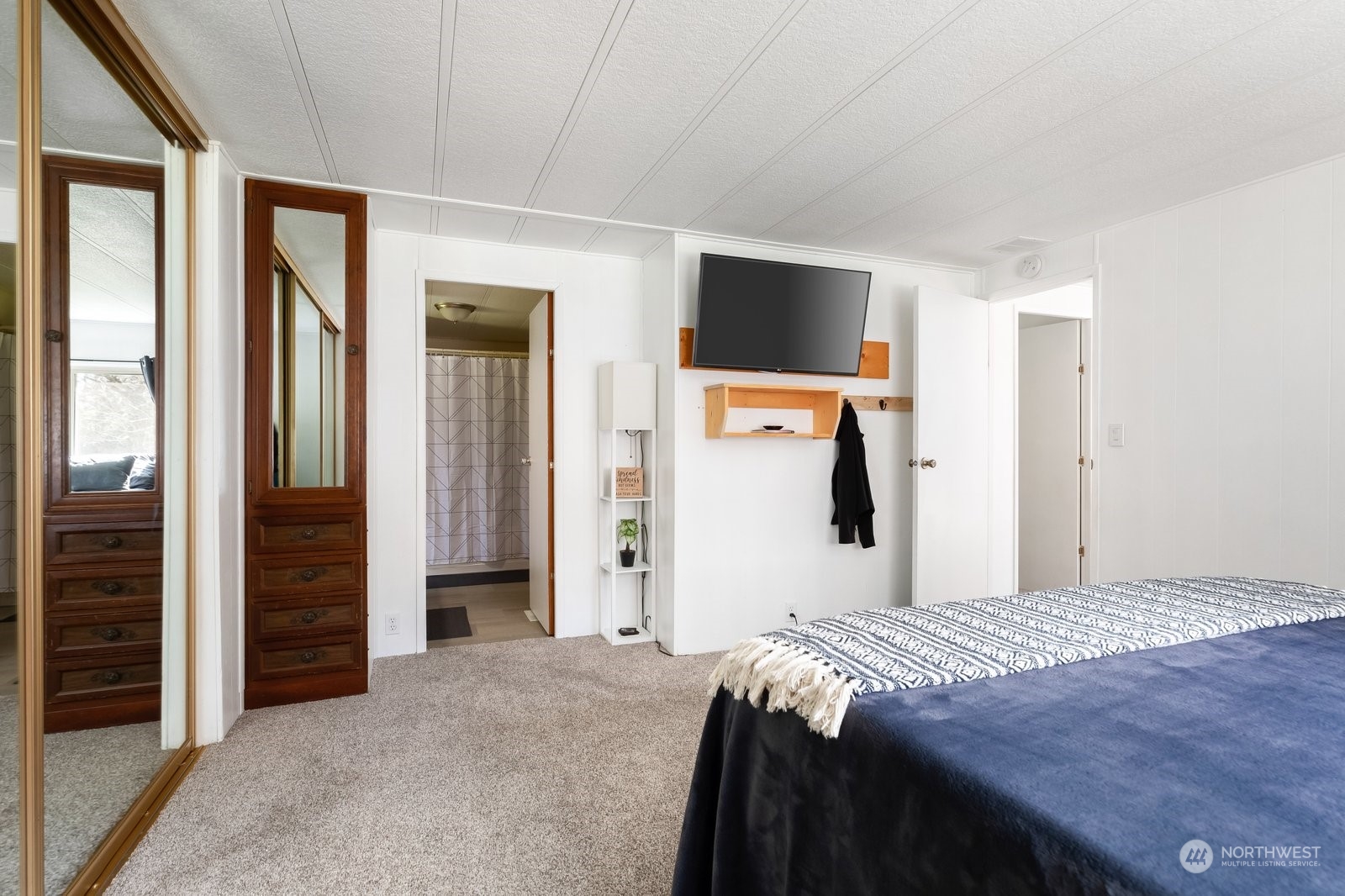 1742 Harns Road Oak Harbor, WA 98277 - Photo 26 of 37 a bedroom with a bed and a flat screen tv