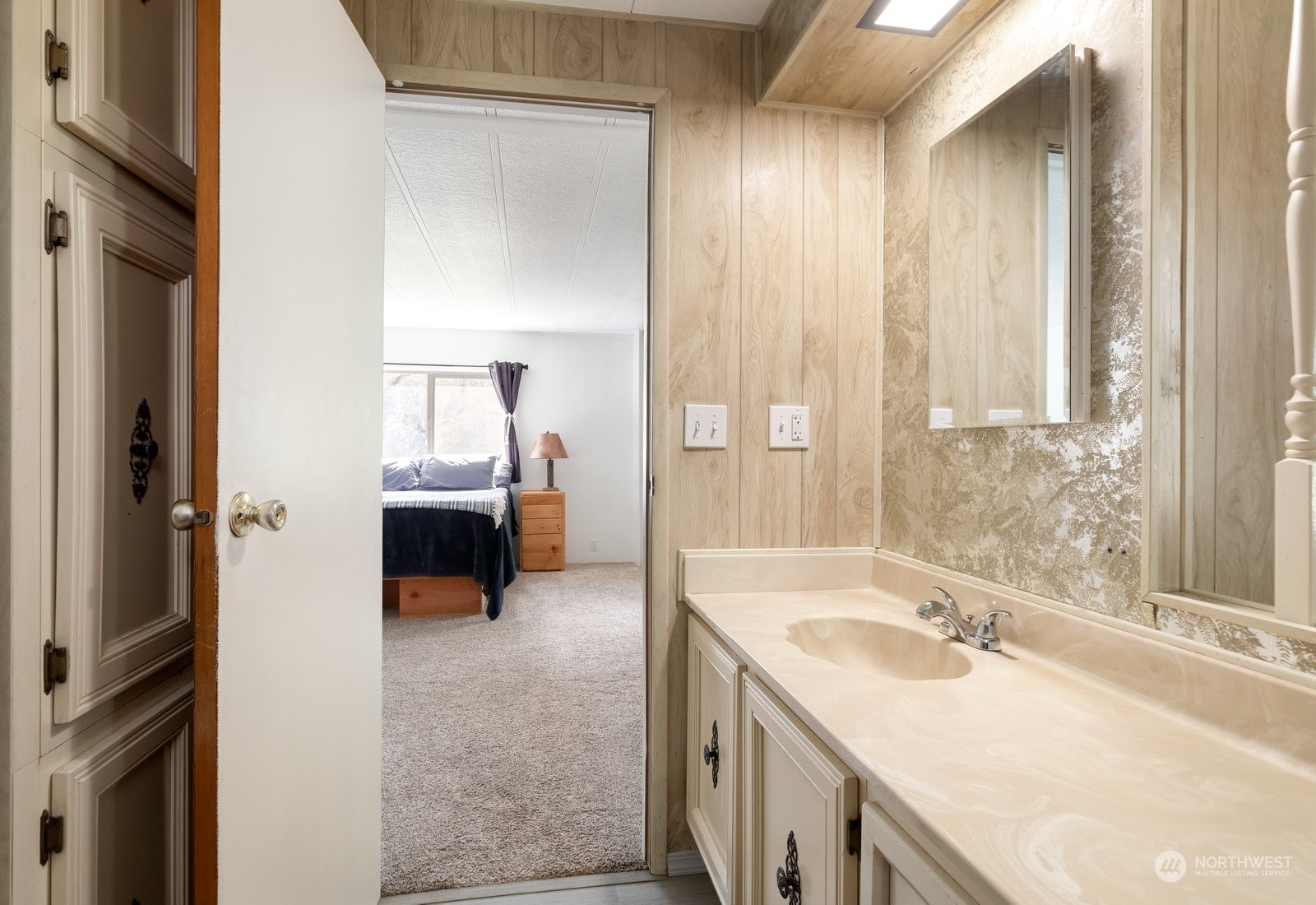 1742 Harns Road Oak Harbor, WA 98277 - Photo 27 of 37 a en suite bathroom with a sink and a large mirror
