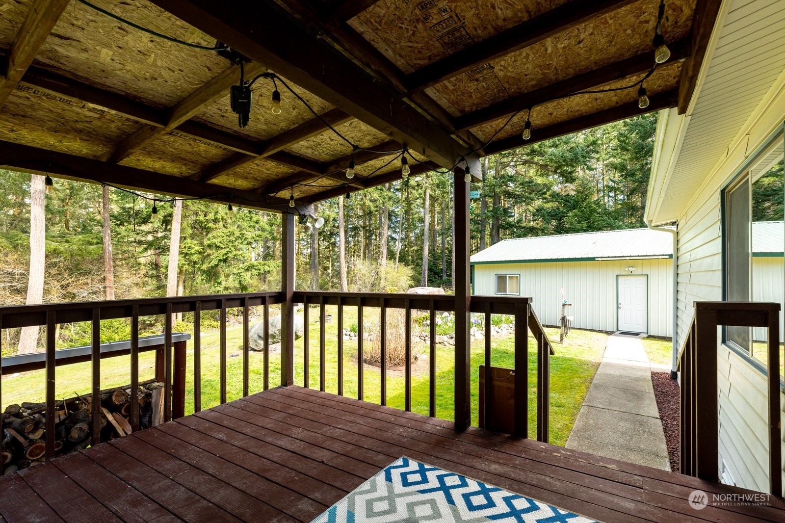 1742 Harns Road Oak Harbor, WA 98277 - Photo 30 of 37 a view of a balcony with furniture and wooden floor