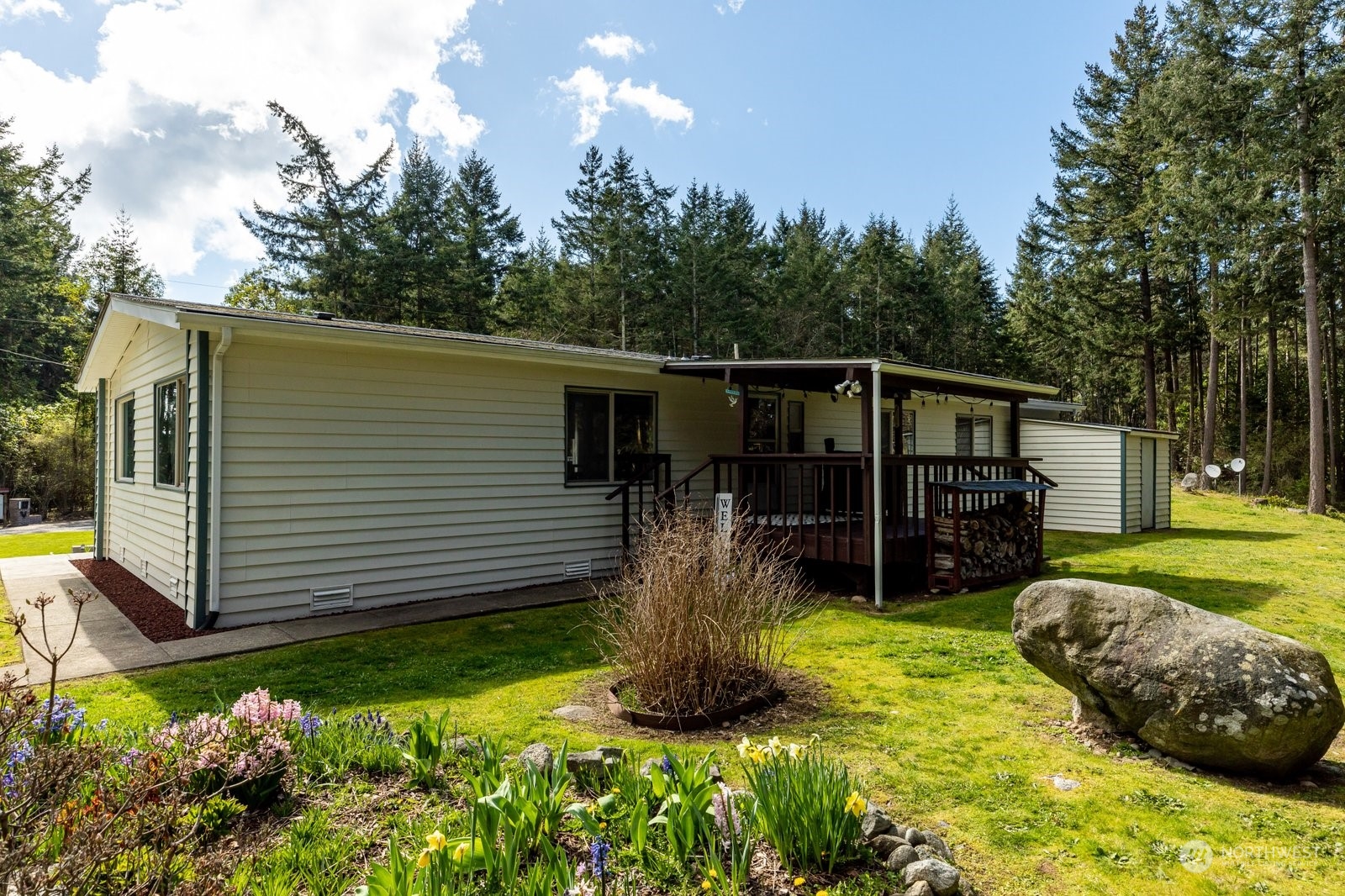 1742 Harns Road Oak Harbor, WA 98277 - Photo 31 of 37 a view of a backyard with potted plants and large tree