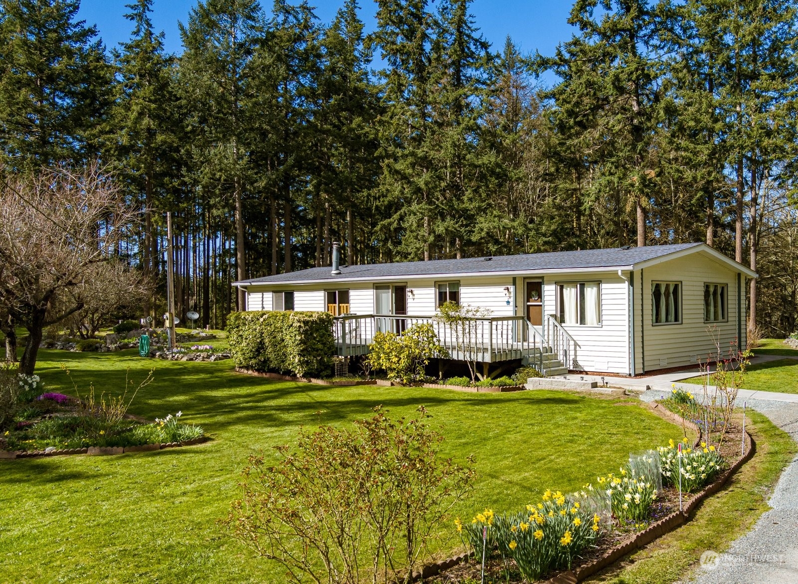 1742 Harns Road Oak Harbor, WA 98277 - Photo 34 of 37 a front view of a house with a yard table and chairs