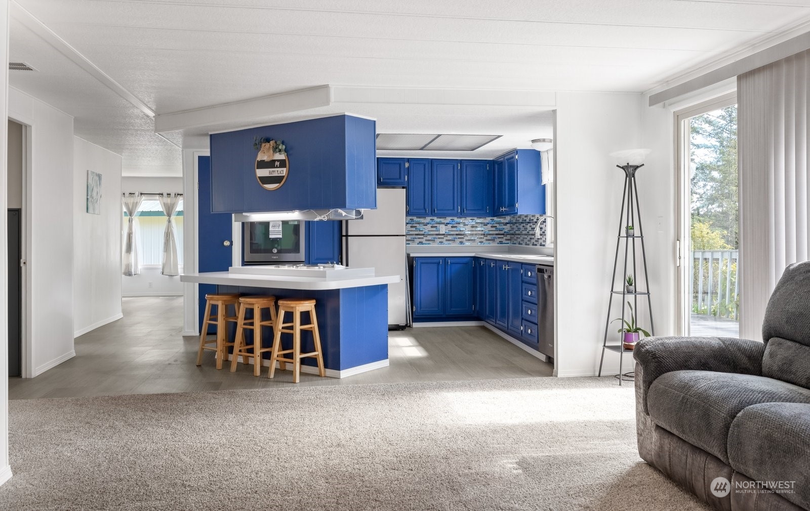 1742 Harns Road Oak Harbor, WA 98277 - Photo 10 of 37 a living room with stainless steel appliances kitchen island granite countertop furniture and a large window