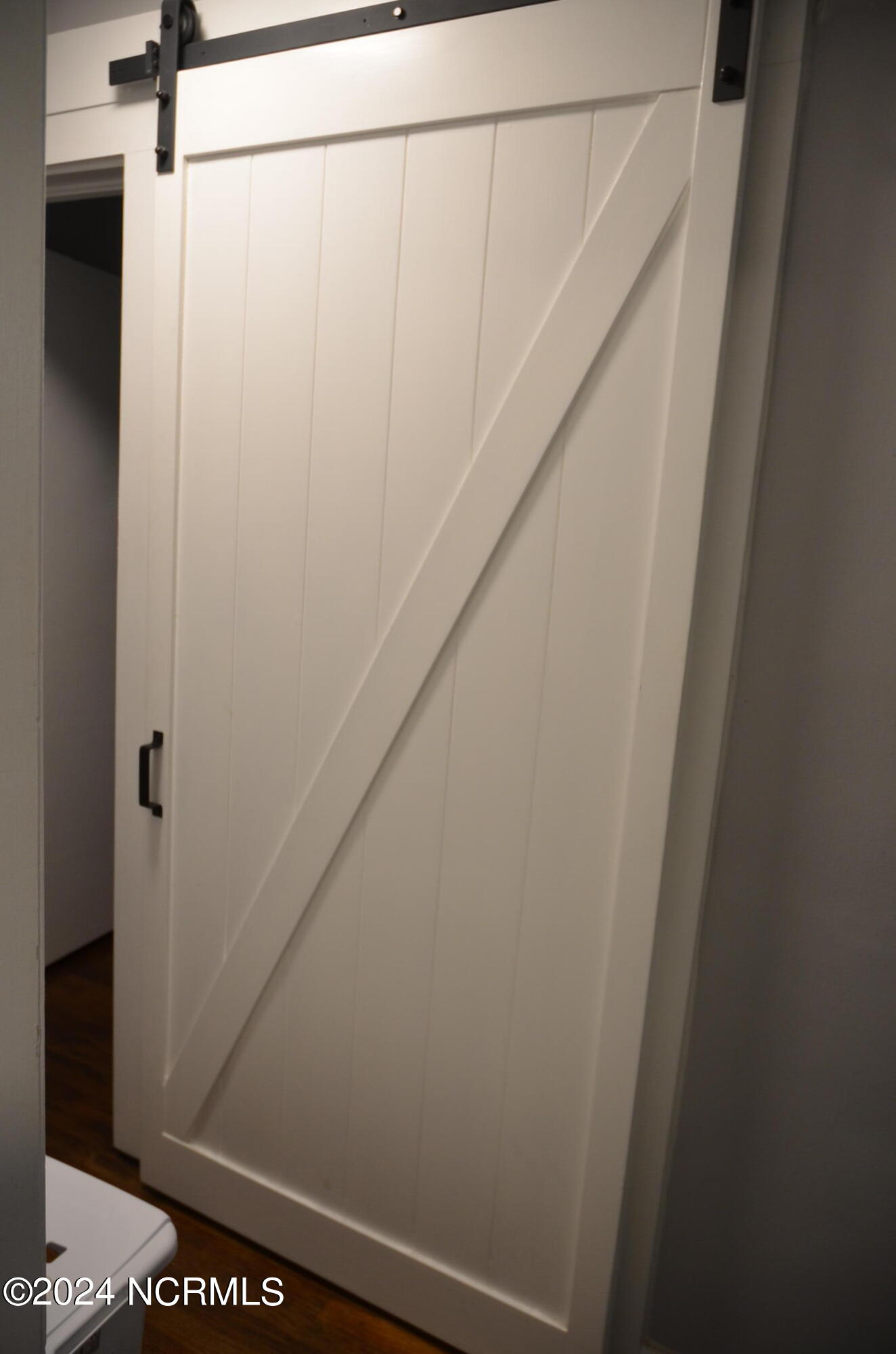 1917 Beverly Road Rocky Mount, NC 27801 - Photo 13 of 28 Barn door to washer/dryer