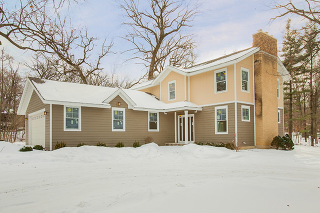 5N353 Crane Road St. Charles, IL 60175 - Photo 1 of 25 a front view of a house with a yard and garage