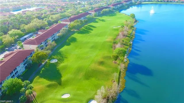 a view of a swimming pool with a lake view