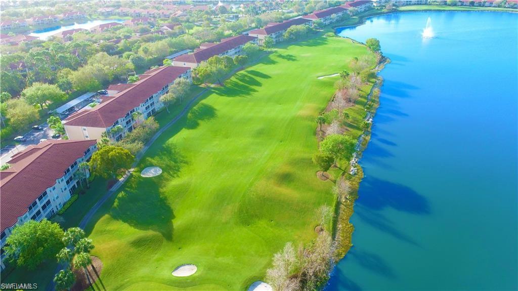 2925 Cypress Trace Circle, Unit 201 Naples, FL 34119 - Photo 20 of 50 a view of a garden