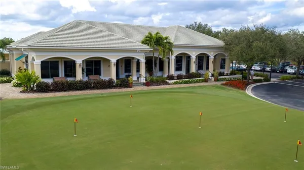 an aerial view of a house with outdoor space and lake view