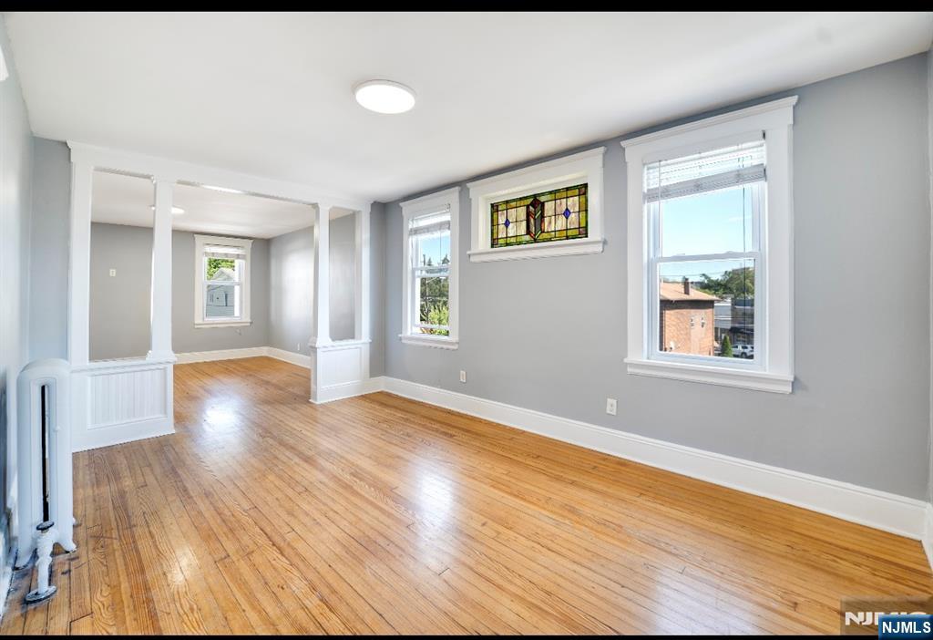 a view of livingroom with hardwood floor and hallway