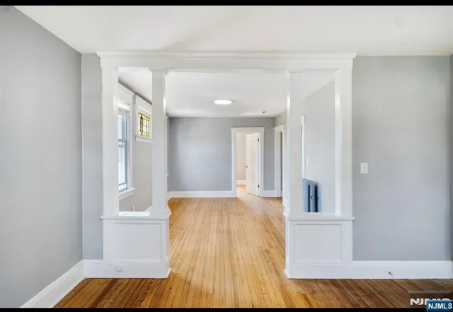 a view of livingroom with hardwood floor and bedroom
