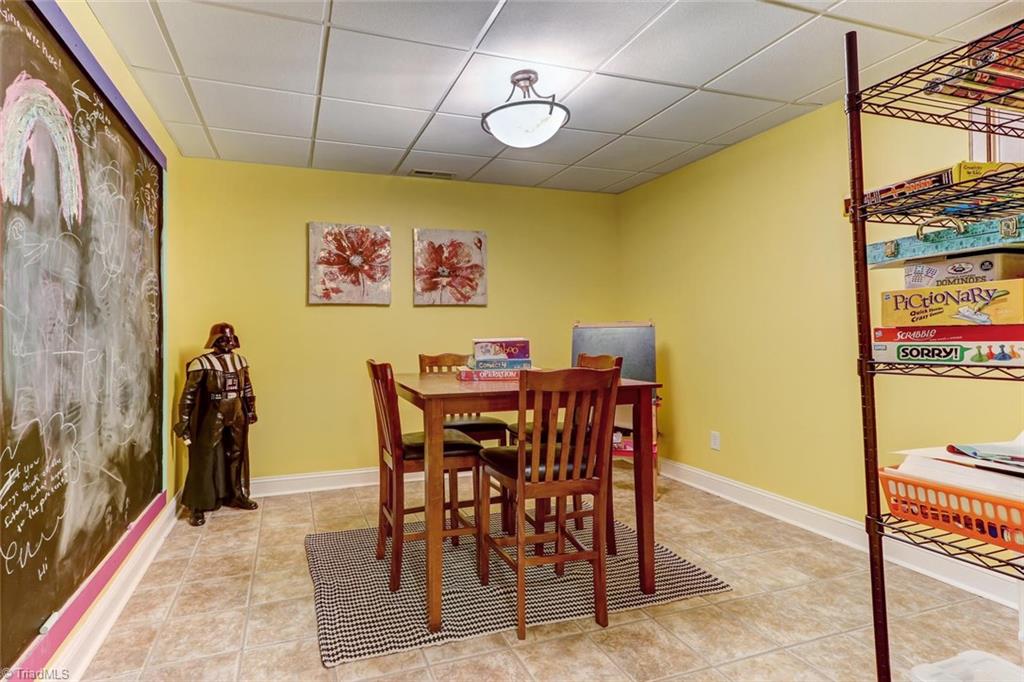 4905 Leadenhall Road Oak Ridge, NC 27310 - Photo 22 of 30 Extra room downstairs is currently used for a craft/game room.