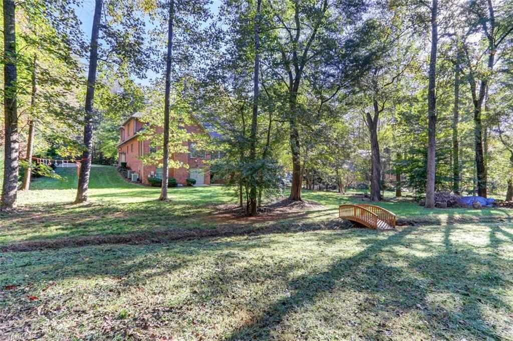 4905 Leadenhall Road Oak Ridge, NC 27310 - Photo 29 of 30 Another view of the backyard.