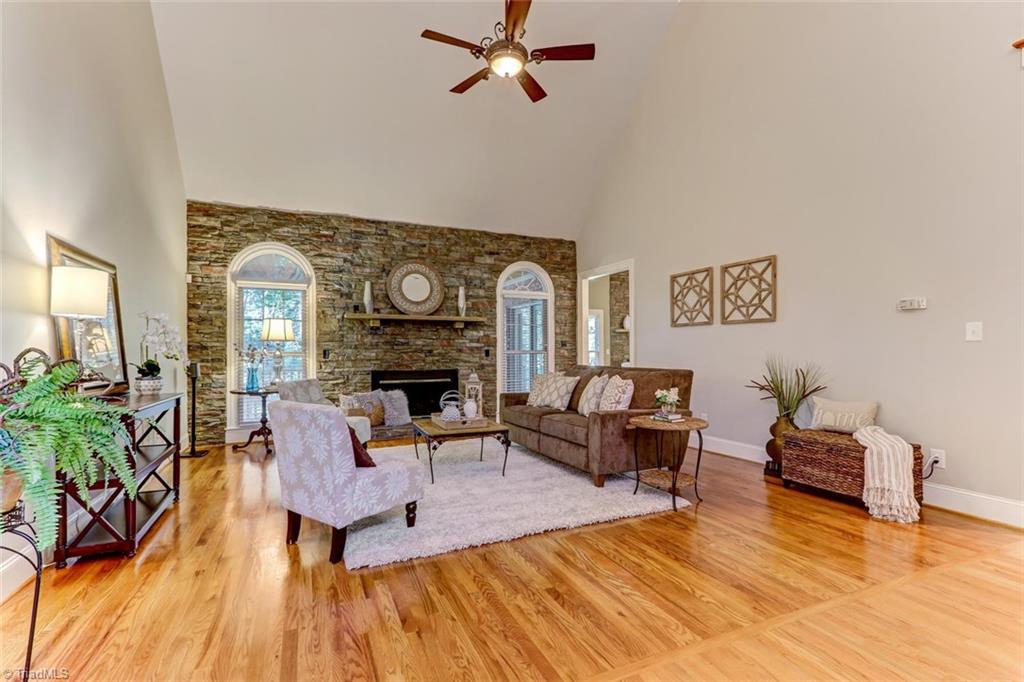4905 Leadenhall Road Oak Ridge, NC 27310 - Photo 4 of 30 Inviting two story great room with stone accent wall and fireplace.