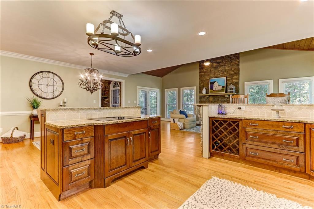 4905 Leadenhall Road Oak Ridge, NC 27310 - Photo 9 of 30 Entire kitchen and dining area opens up to keeping room!