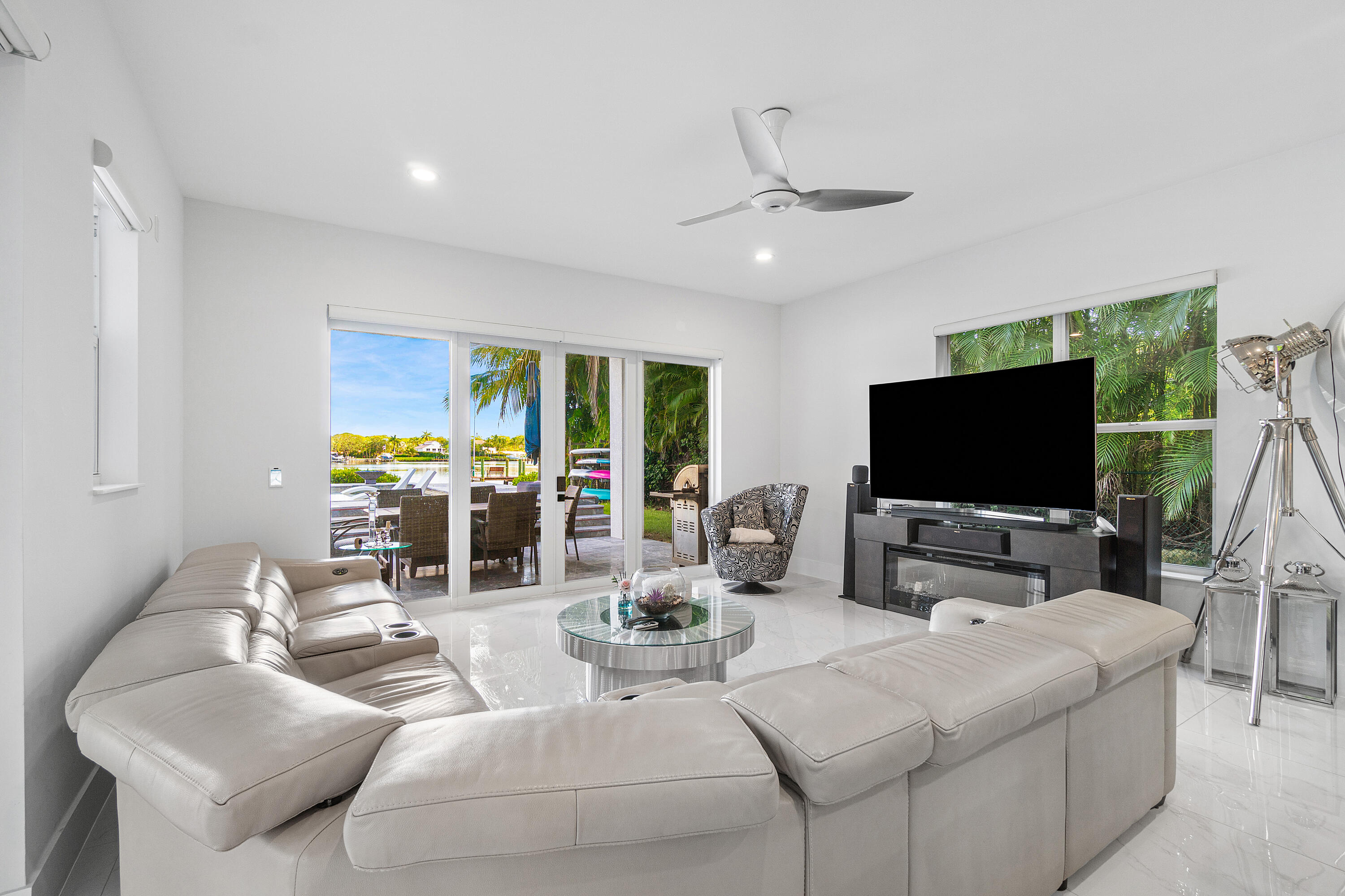 5447 Center Street Jupiter, FL 33458 - Photo 15 of 60 a living room with furniture and a flat screen tv