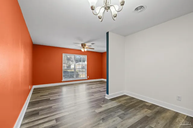 a kitchen with a sink a stove and a refrigerator
