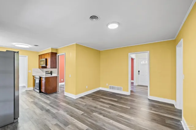 a view of an empty room with a window