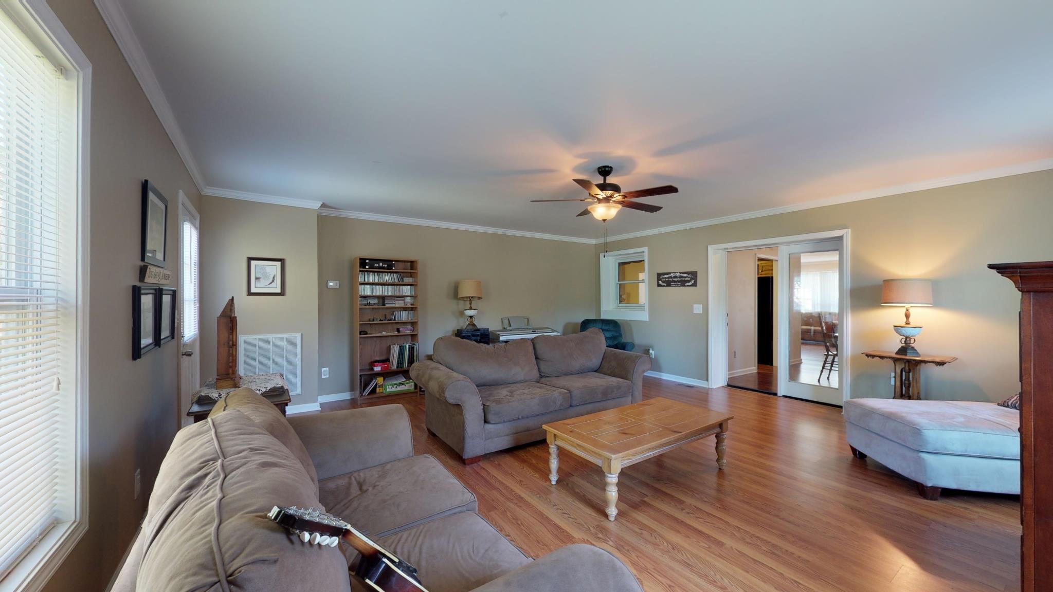 101 Raspberry Lane Smyrna, TN 37167 - Photo 23 of 30 Gathering room with wood floors and French doors in entry way to dining room! 101 Raspberry Ln, Smyrna, TN 37167