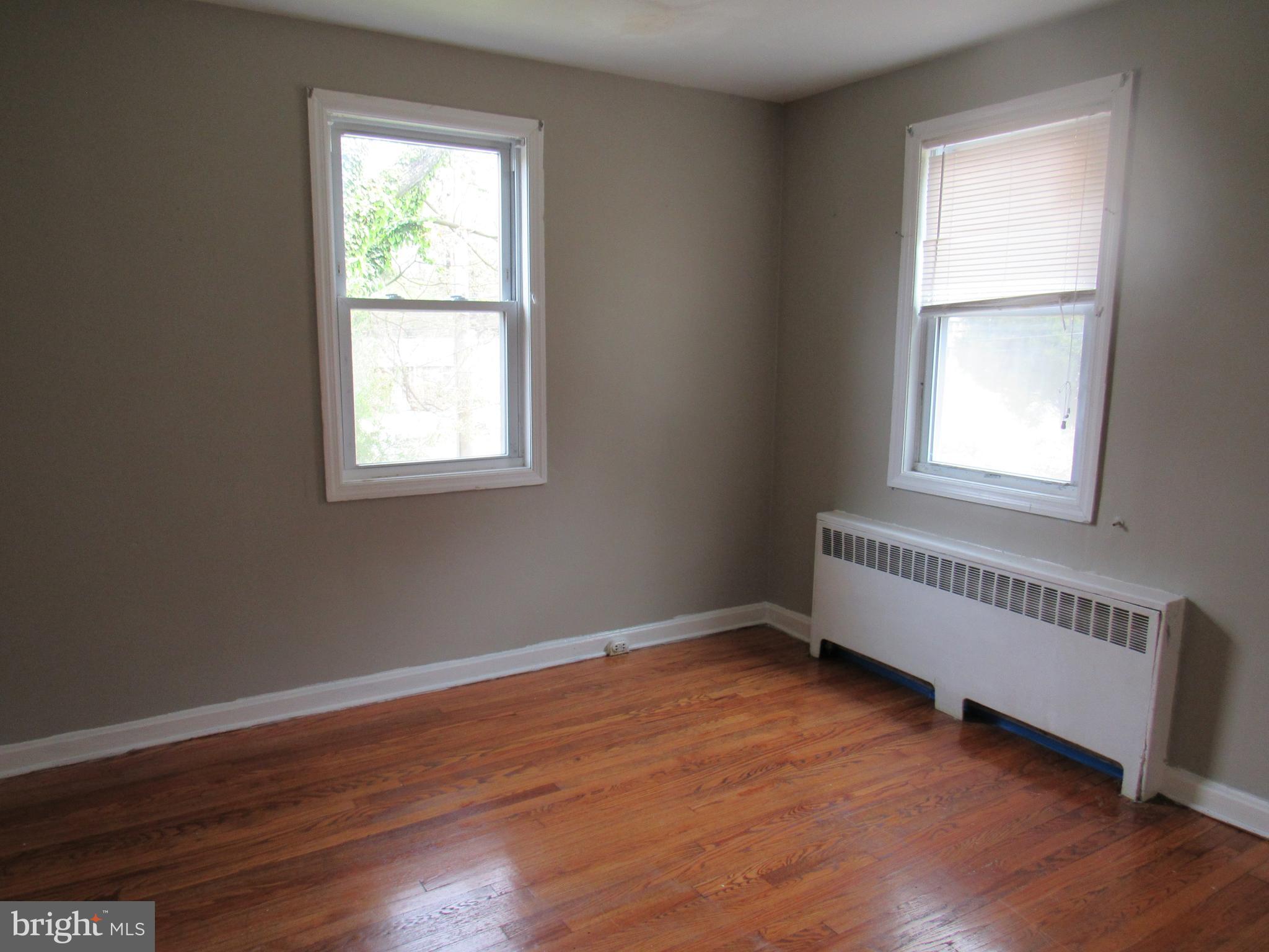 11512 Veirs Mill Road Silver Spring, MD 20902 - Photo 11 of 14 Bright and light bedrooms with hardwood floors.