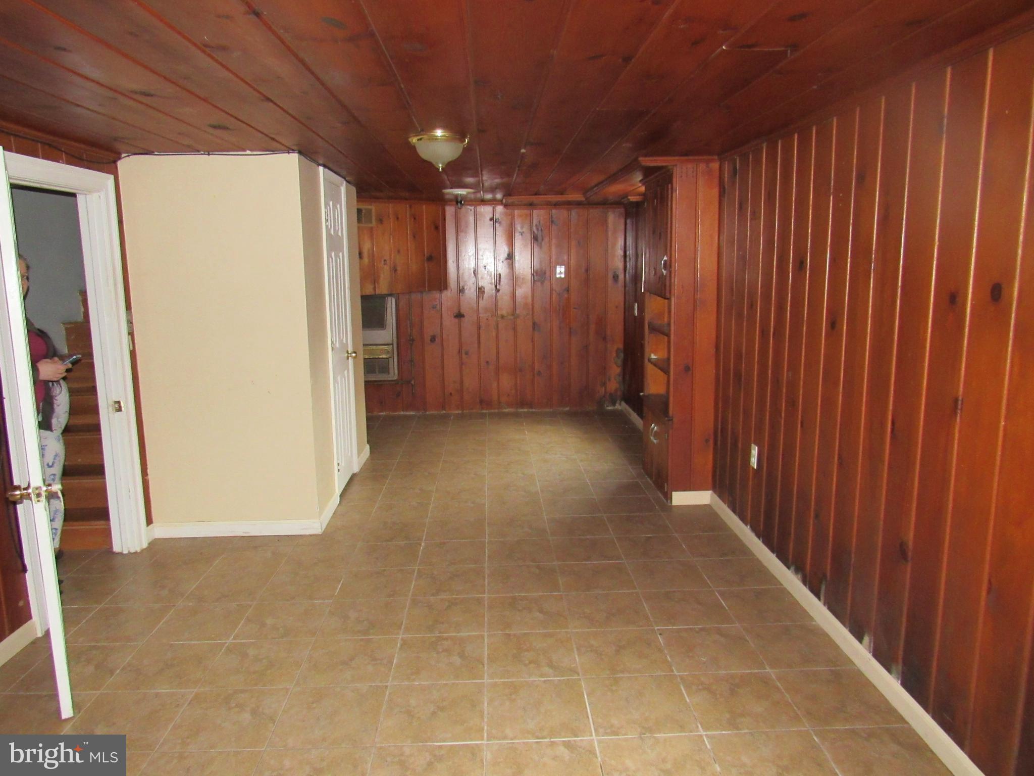 11512 Veirs Mill Road Silver Spring, MD 20902 - Photo 7 of 14 Basement finished with new tile floor.