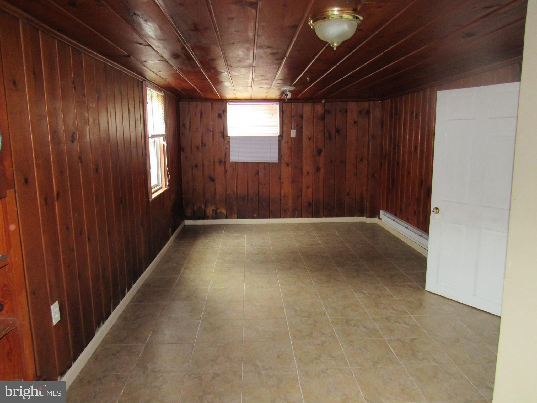 11512 Veirs Mill Road Silver Spring, MD 20902 - Photo 8 of 14 Basement has large bedroom and full bath.