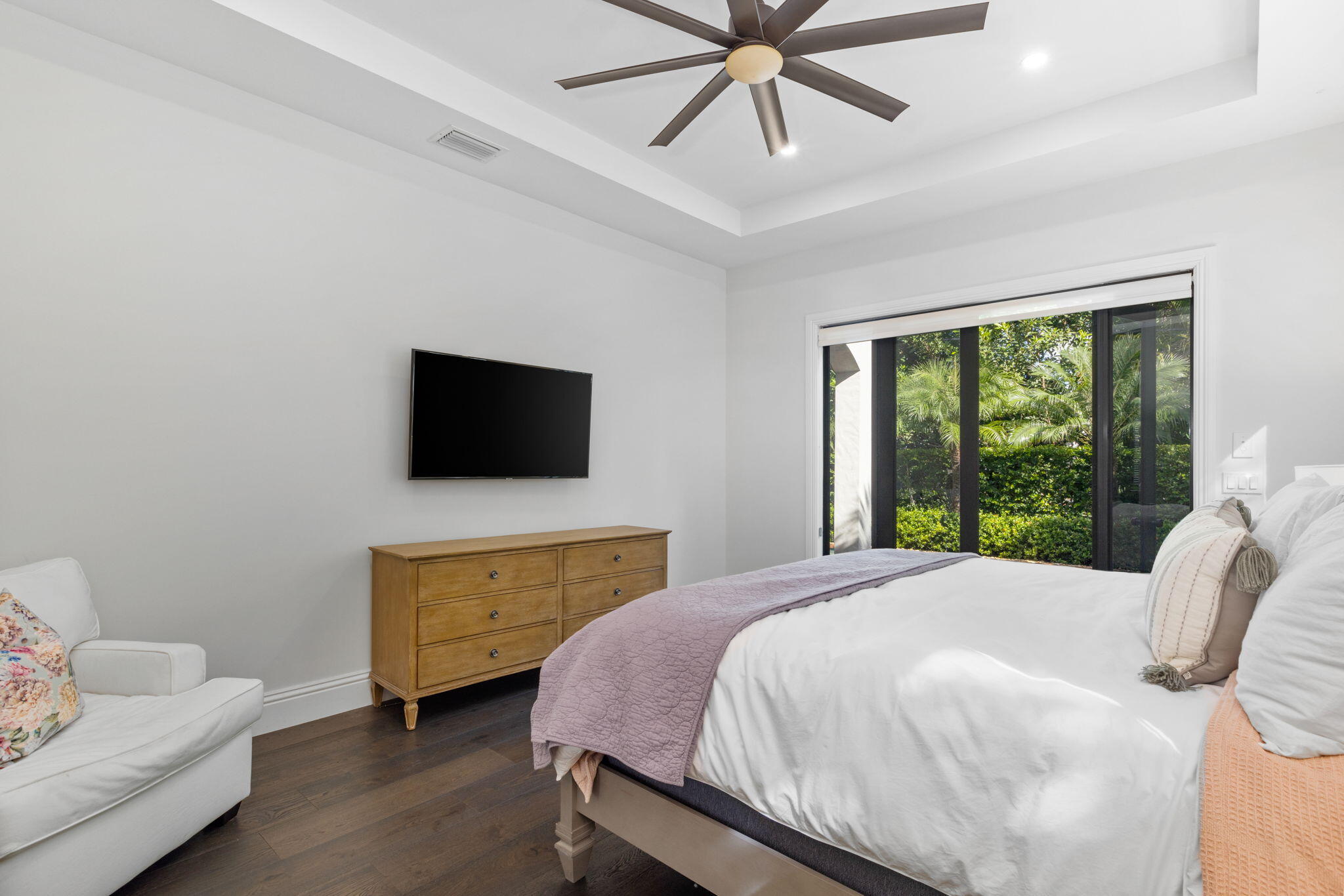 249 Edmor Road West Palm Beach, FL 33405 - Photo 14 of 49 a bedroom with a bed and a flat screen tv