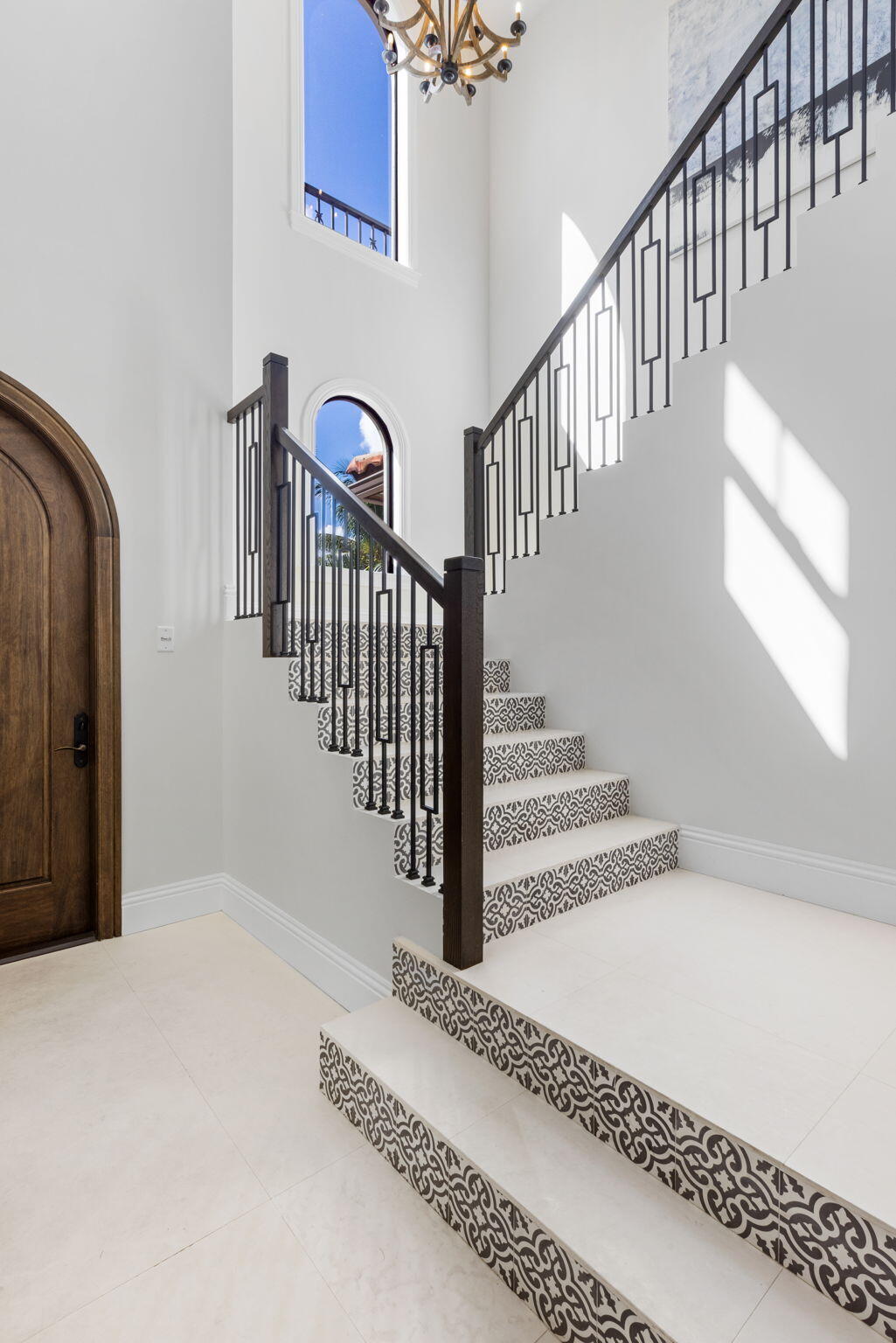 249 Edmor Road West Palm Beach, FL 33405 - Photo 16 of 49 a view of staircase with lots of frames and a rug