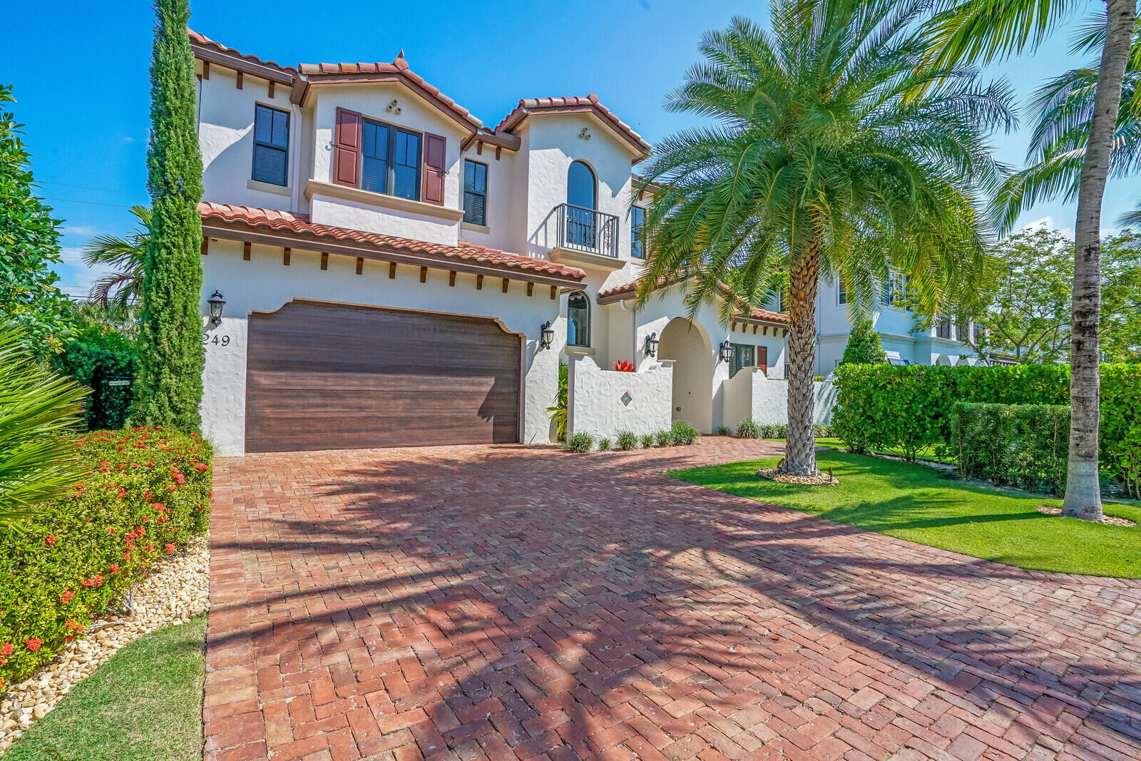 249 Edmor Road West Palm Beach, FL 33405 - Photo 2 of 49 a front view of a house with a yard and a garage