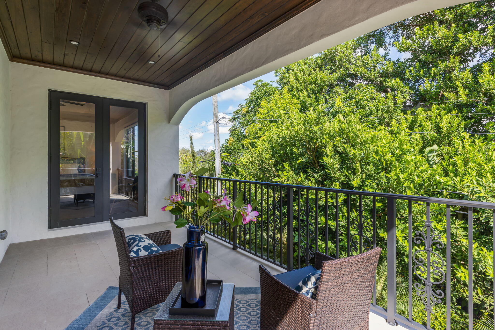 249 Edmor Road West Palm Beach, FL 33405 - Photo 22 of 49 a balcony with potted plants and wooden fence