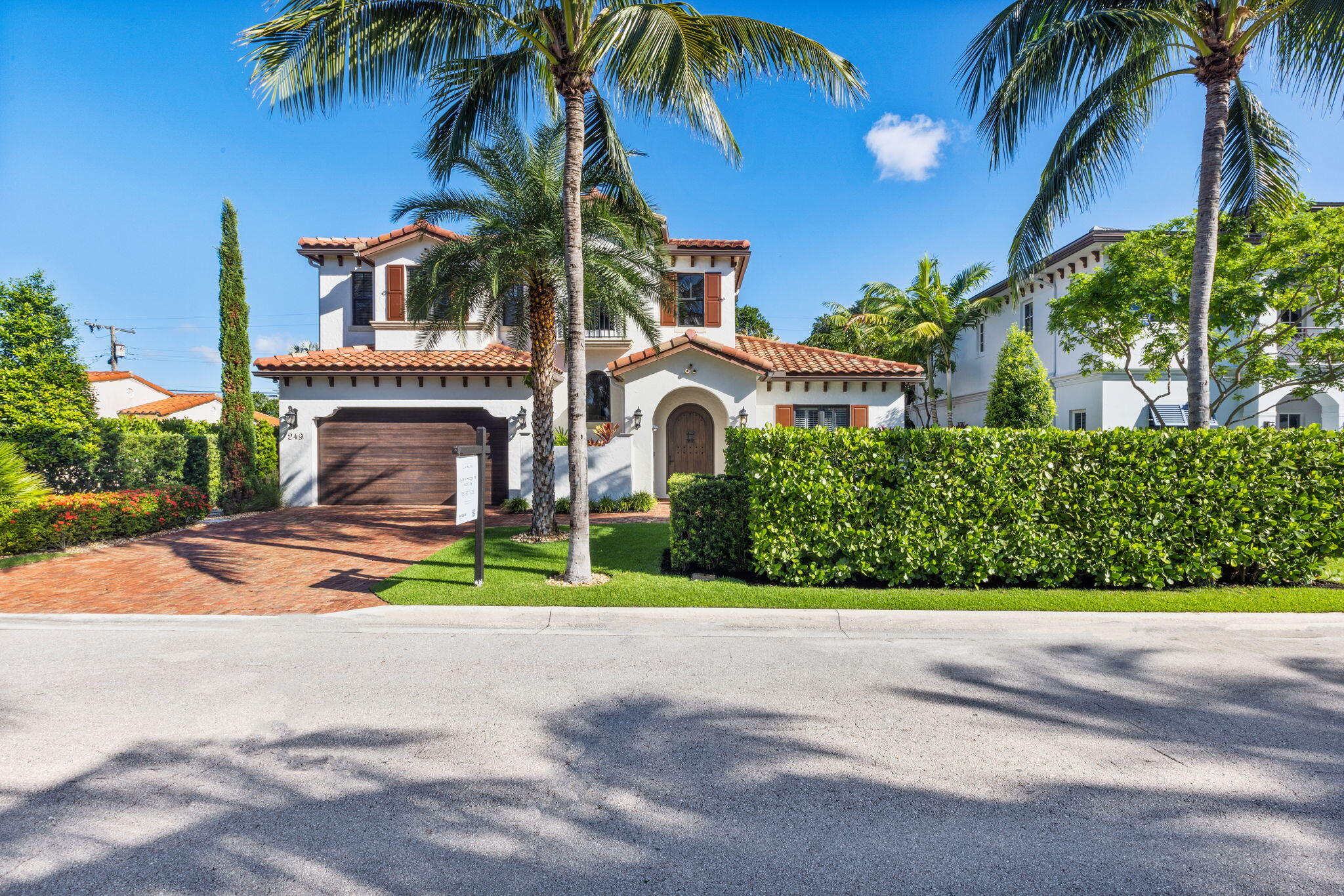 249 Edmor Road West Palm Beach, FL 33405 - Photo 4 of 49 a front view of a house with a garden and a yard
