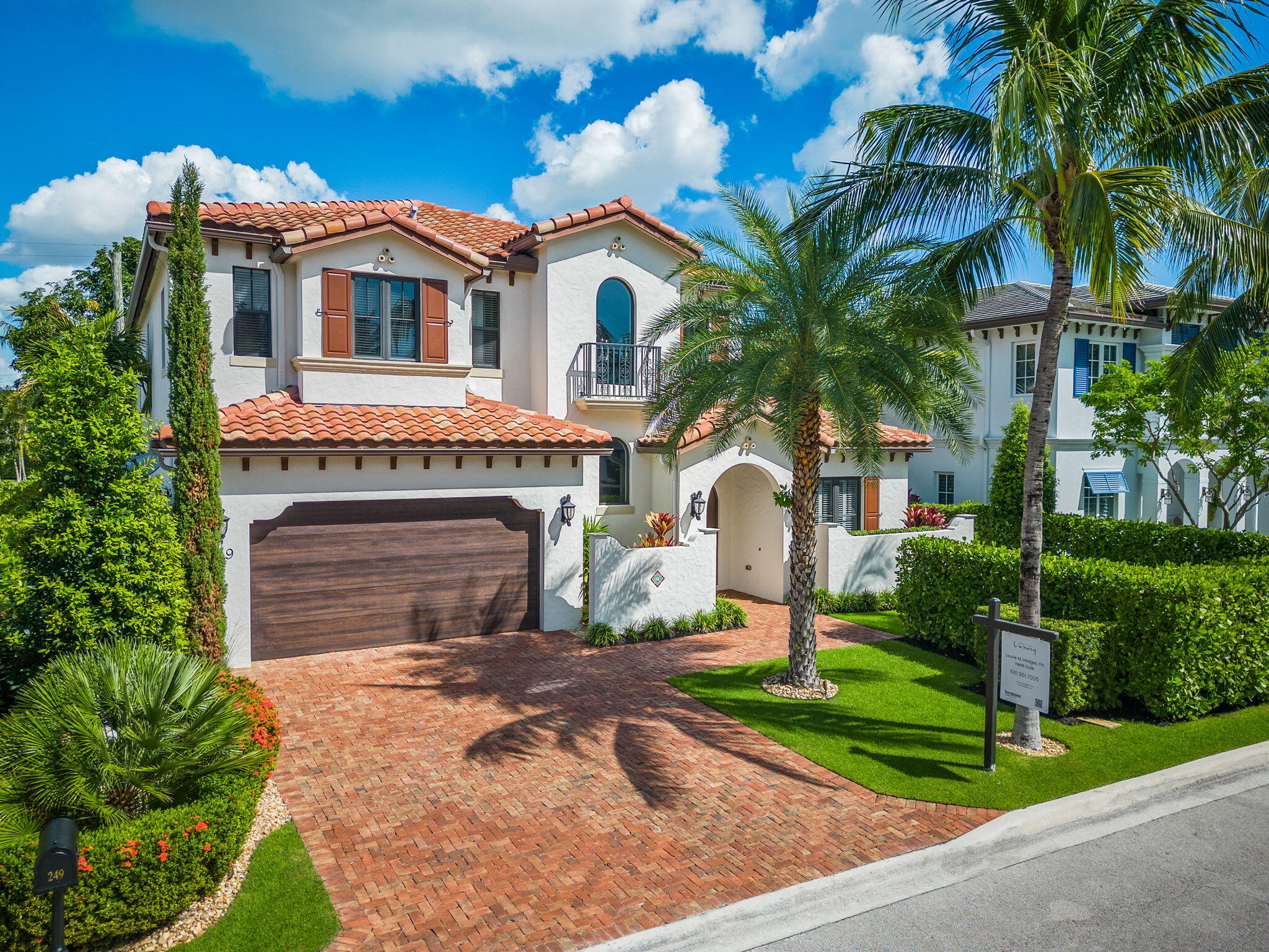 249 Edmor Road West Palm Beach, FL 33405 - Photo 45 of 49 a front view of a house with a yard and garage