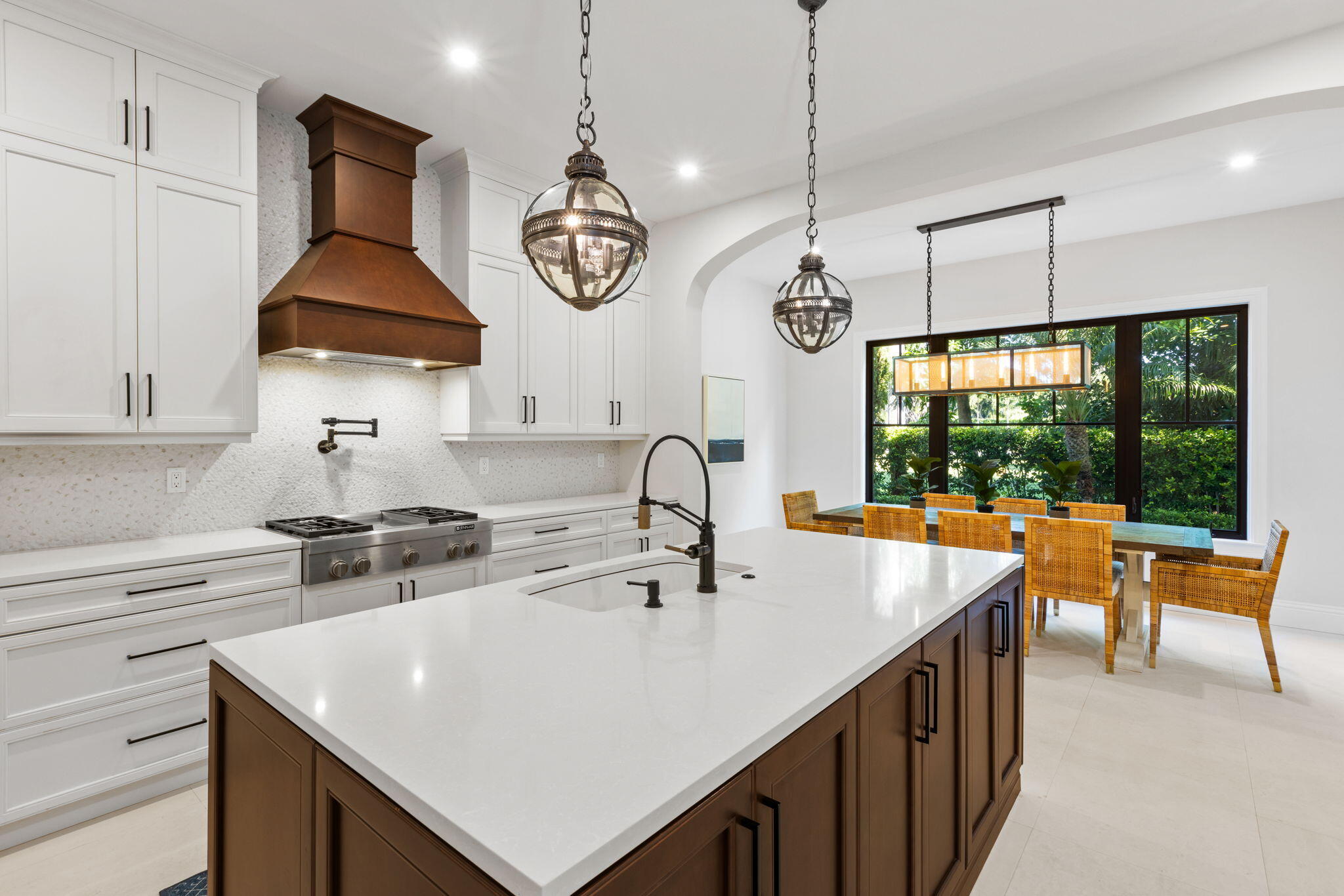 249 Edmor Road West Palm Beach, FL 33405 - Photo 9 of 49 a kitchen with stainless steel appliances a stove a sink a center island and windows