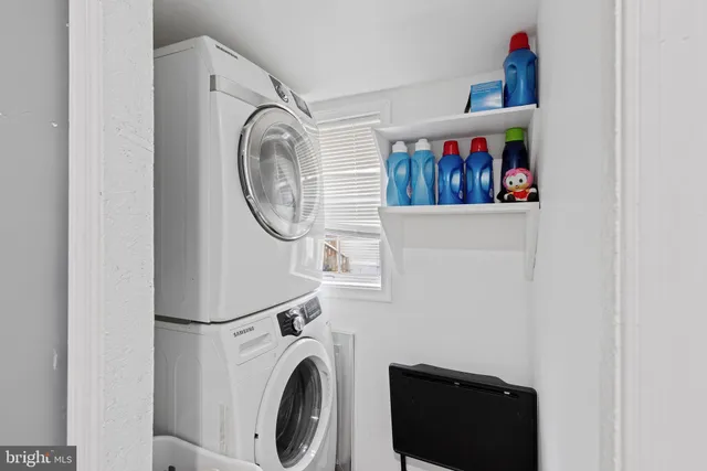 a view of storage and utility room with washer and dryer