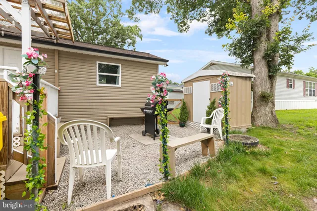 a view of a house with a yard and balcony