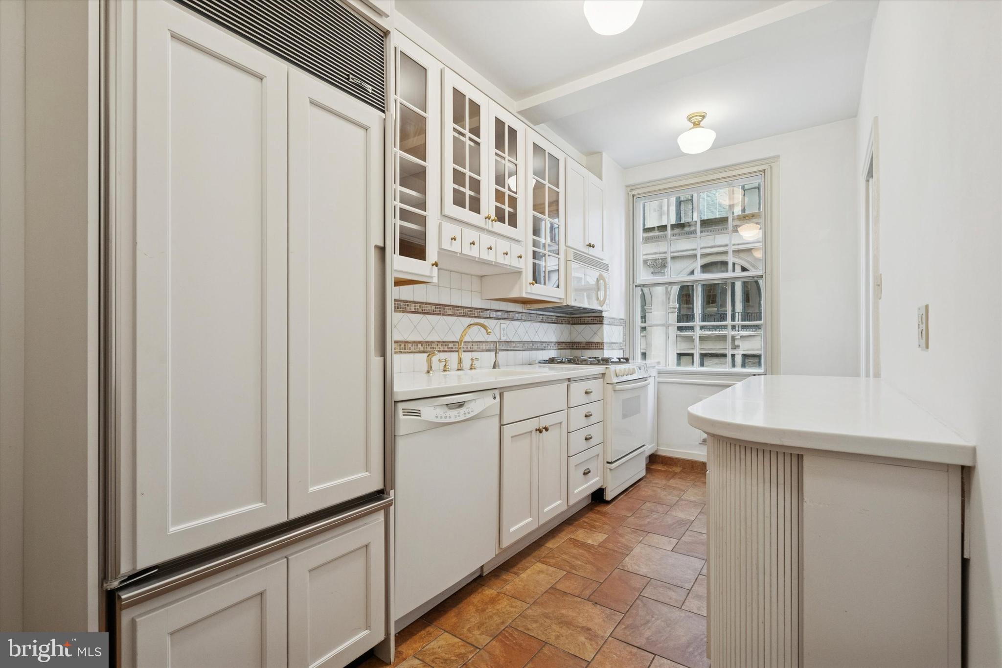 1900-00 Rittenhouse Square, Unit 3C Philadelphia, PA 19103 - Photo 12 of 25 a kitchen with stainless steel appliances a refrigerator and cabinets