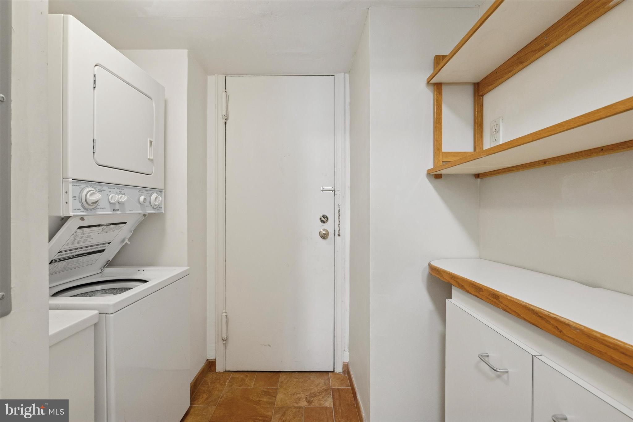 1900-00 Rittenhouse Square, Unit 3C Philadelphia, PA 19103 - Photo 15 of 25 a view of storage and utility room with washer and dryer