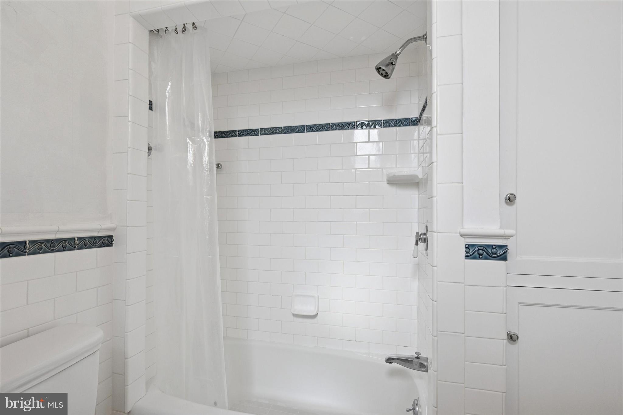1900-00 Rittenhouse Square, Unit 3C Philadelphia, PA 19103 - Photo 21 of 25 a bathroom with a glass shower door