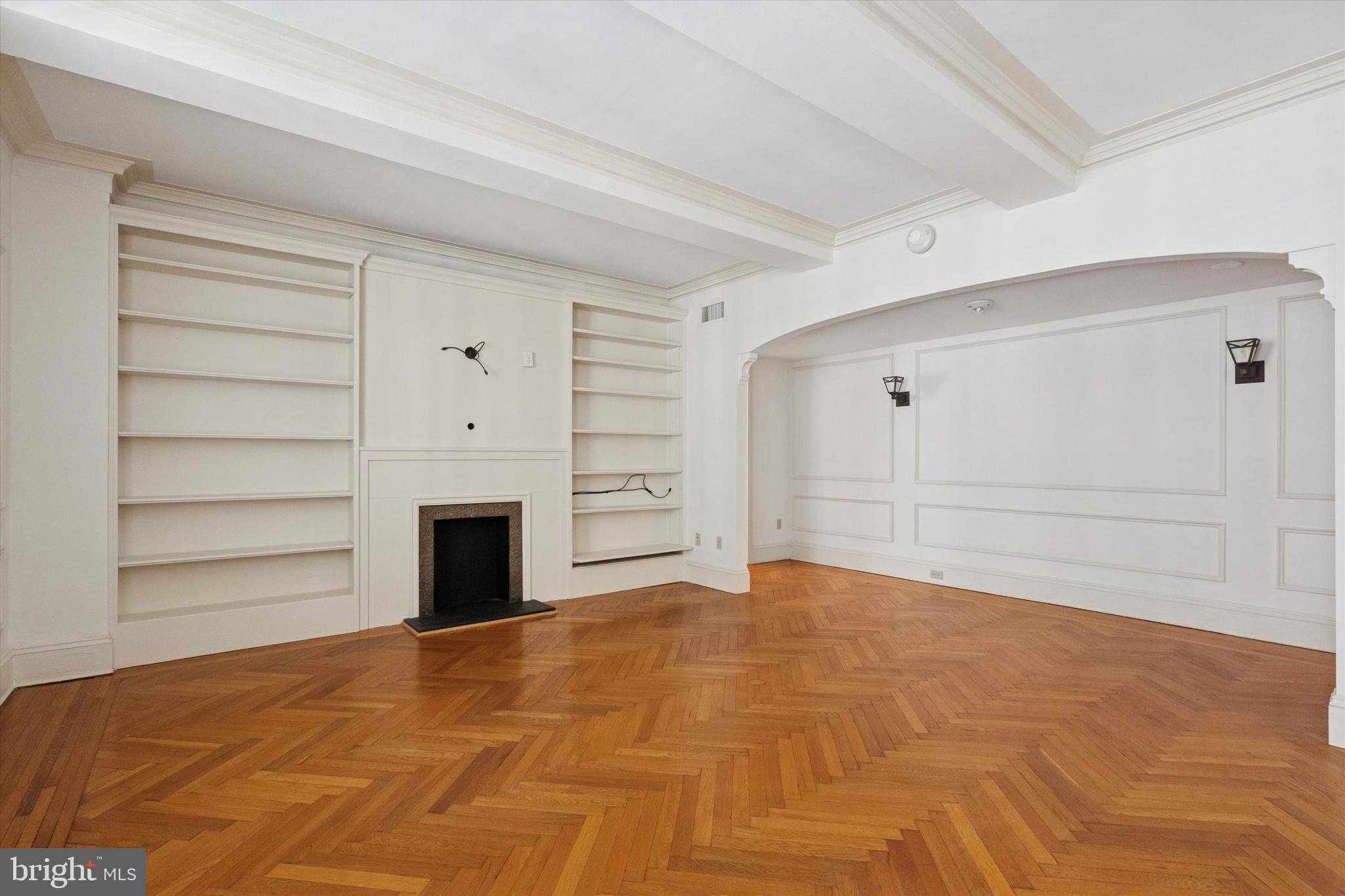 1900-00 Rittenhouse Square, Unit 3C Philadelphia, PA 19103 - Photo 4 of 25 a view of empty room with cabinet and fireplace