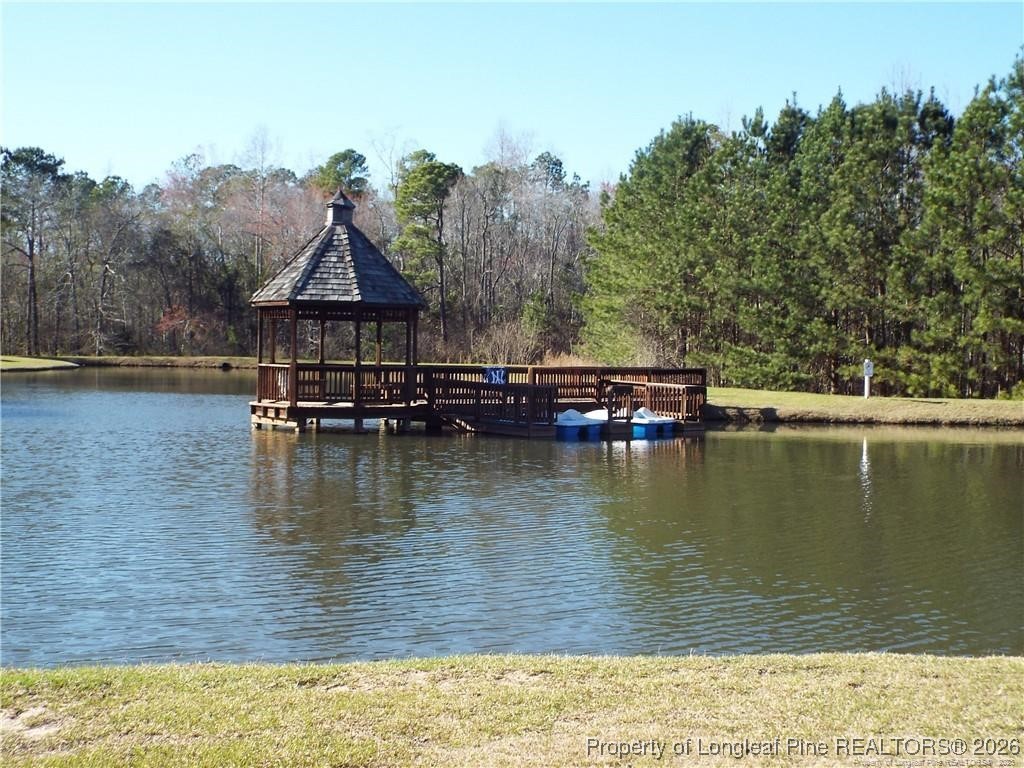 16 Cottswold Lane Spring Lake, NC 28390 - Photo 41 of 49 a view of a lake with houses