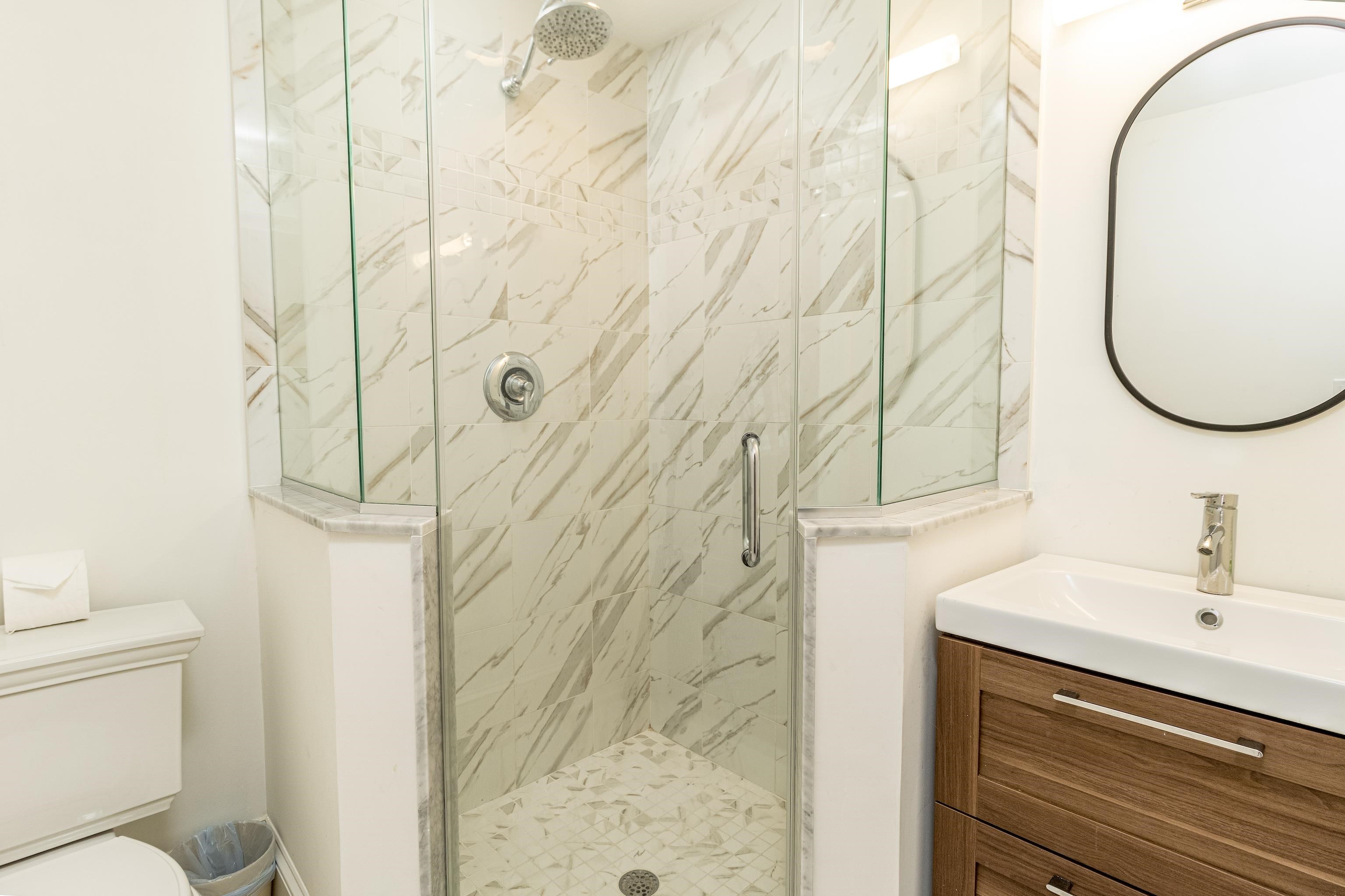 153 76th Street Avalon, NJ 08202 - Photo 11 of 33 a bathroom with a sink a toilet and shower