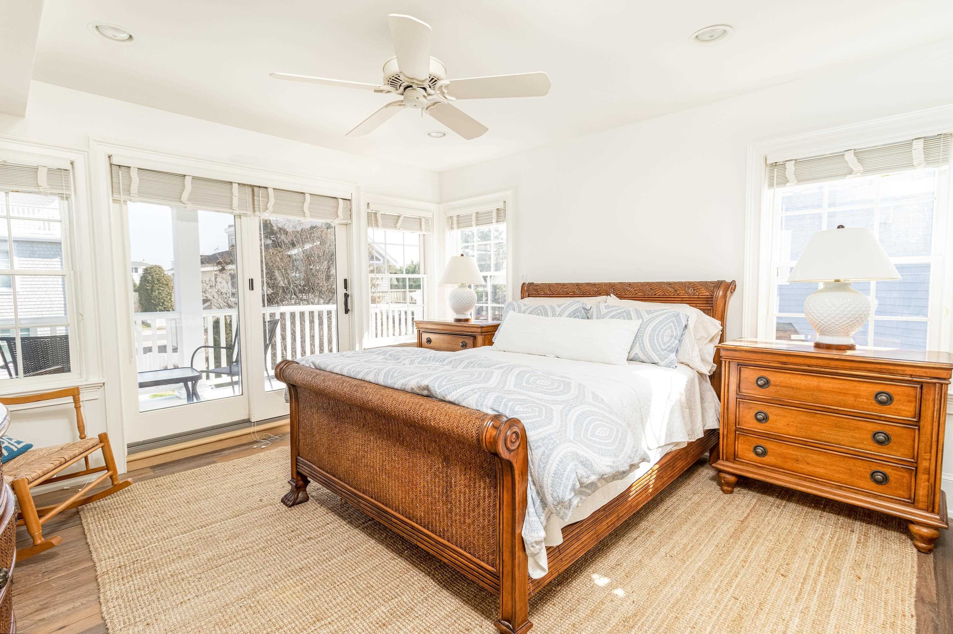 153 76th Street Avalon, NJ 08202 - Photo 16 of 33 a bed room with a bed and a dresser