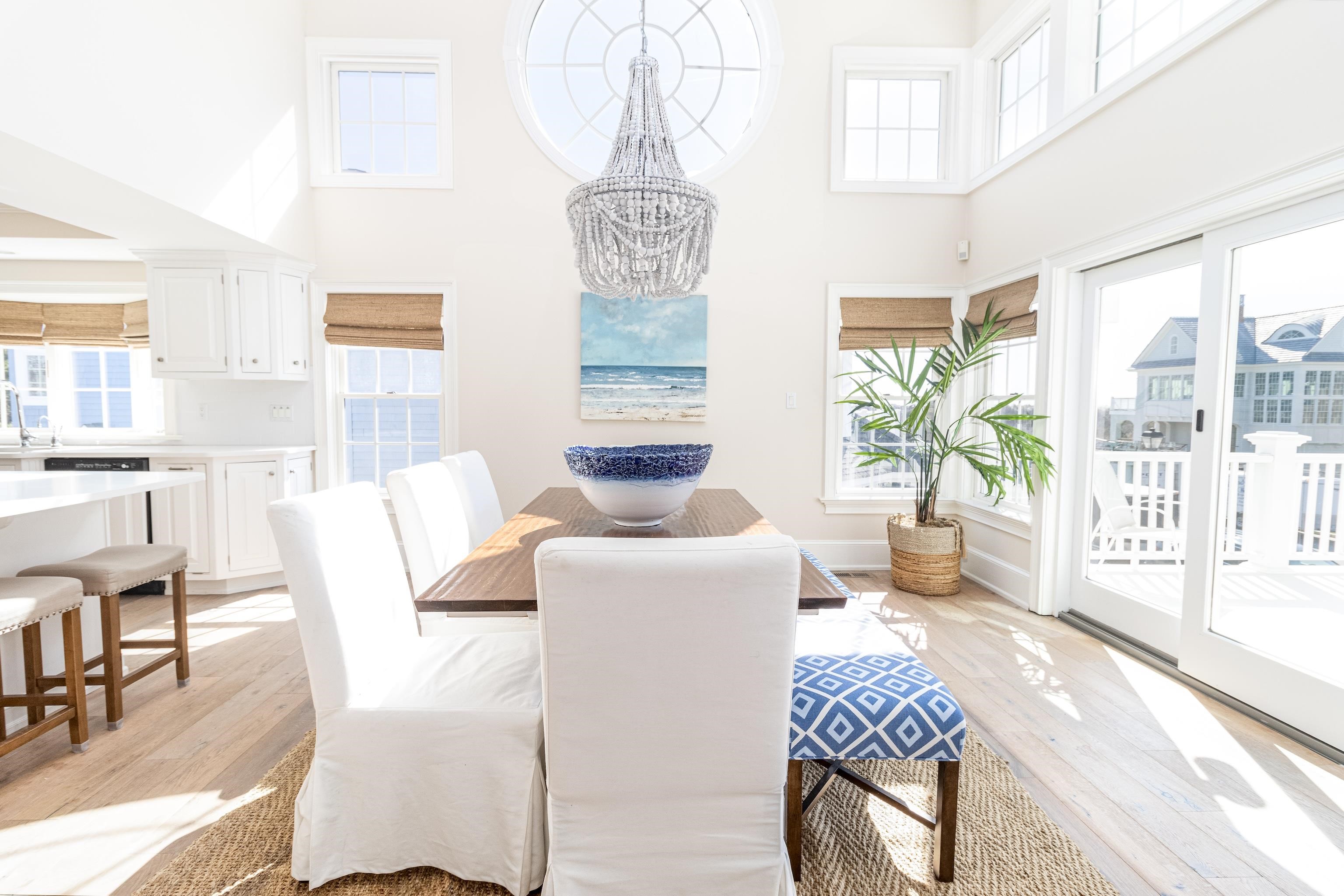153 76th Street Avalon, NJ 08202 - Photo 20 of 33 a living room with furniture and a floor to ceiling window
