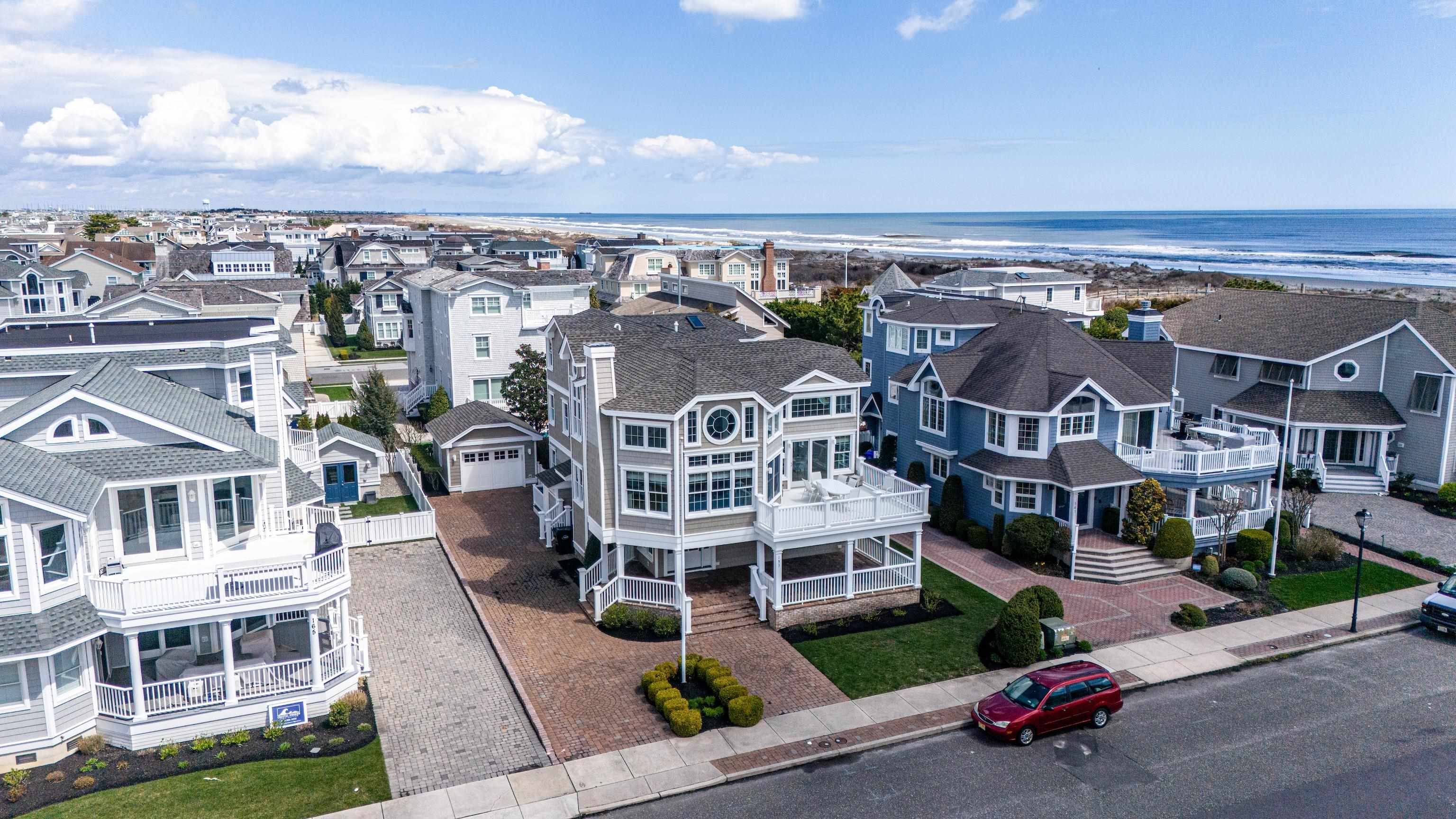 153 76th Street Avalon, NJ 08202 - Photo 2 of 33 an aerial view of a large building with a view of a city